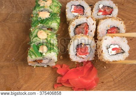 Sushi Rolls On A Wooden Board Delicious Food