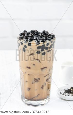 Bubble Milk Tea With Tapioca Pearl Topping, Famous Taiwanese Drink On White Wooden Table Background