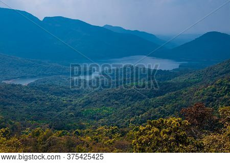 View On Lake And Mountains In Goa, India. By The Road To Surla Waterfall