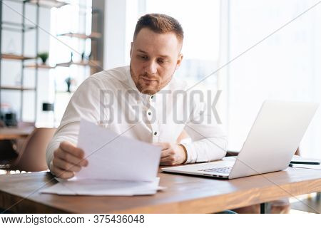 Business Man Wearing Fashion Casual Clothing Is Typing On Laptop Computer And Working With Paper Doc