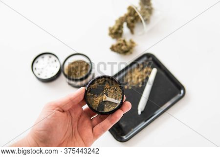 Marijuana Nature Bud. White Background. Kief In Grinder. Indica Sativa Medical Health.