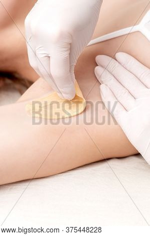 Hand Of Cosmetologist Applying Wax Paste On Armpit. Depilation Or Epilation Female Armpit With Liqui