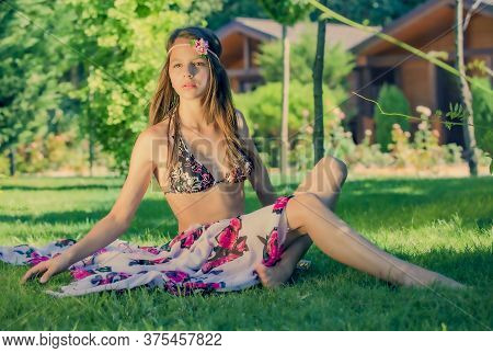 Portrait Of A Beautiful Cute Brunette Teenager Model With Makeup, Poreo, In Summer Swimwear Posing O