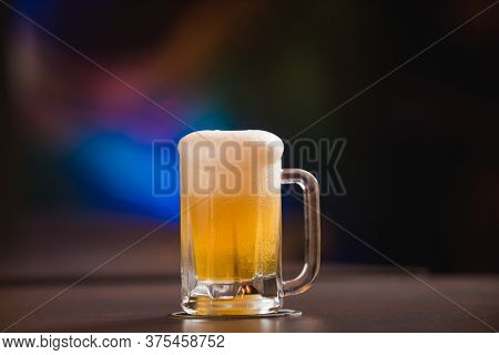 Mug Full Of Chopp, With Chopp Pilsen On A Rustic Table