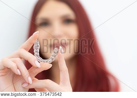 Girl With A Beautiful Smile Shows A Transparent Mouth Guard