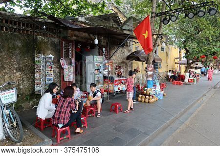 Hoi An, Vietnam, June 15, 2020: People sitting in a bar in Hoi An, Vietnam. Ancient city. World heritage