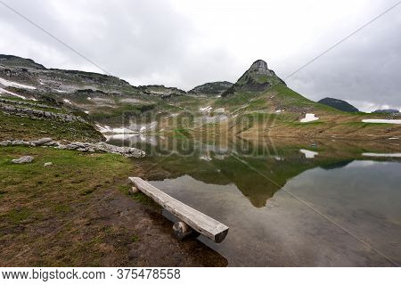 Lake In The Austrian Alps With Reflection From Mountain In The Water. Augstsee. Loser. Austria