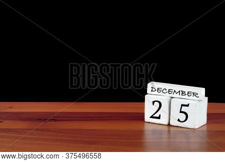 25 December Calendar Month. 25 Days Of The Month. Reflected Calendar On Wooden Floor With Black Back