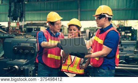 Scene Of Inspectors Team Asking Information With Woman Worker And Checking The Safety And Review The