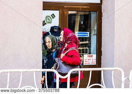 Old Women With Kerchiefs Walking On The Streets Of Lugoj, Romania, 2020
