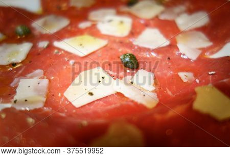 Carpaccio,italian Plate, Raw Meat Sliced,carpers And Parmesan Cheese