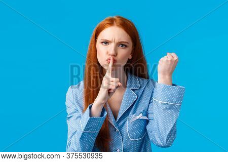 Shut Up Or Else. Angry And Displeased Redhead Girl Threaten Roommate Be Quiet And Shaking Fist, Warn
