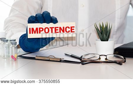 Impotence. Torn Pieces Of Paper With The Words Impotence. Concept Image. Black And White. Closeup.