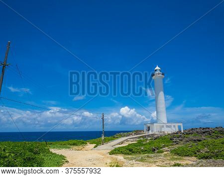 Summer Refreshing Blue Sky And Okinawa's Tourist Attractions, Zanpa Cape Lighthouse And The Sea