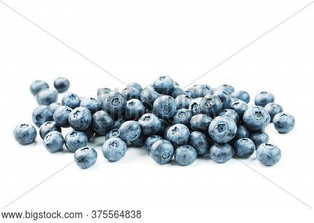 Tasty Blueberries Fruit Are Scattered On A White Background.