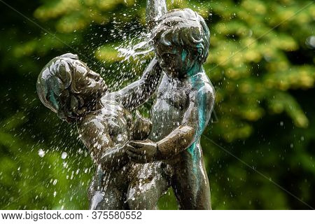 Riga, Latvia- July 3, 2020: Fragment Of The Oldest Riga Fountain Seasons In Vermane Garden, Sculptur