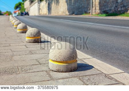 Anti Parking Concrete Spheres At The Pavement Edge