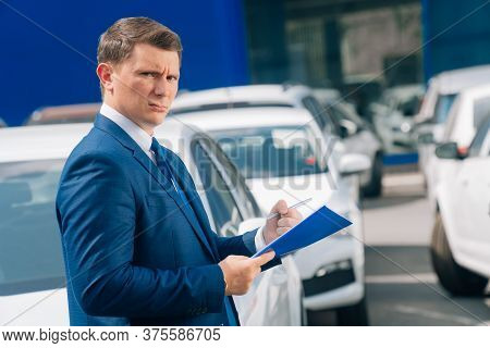 A Man Writes In A Tablet Next To The Car. An Accident On The Road, The Airbag Didnt Work.