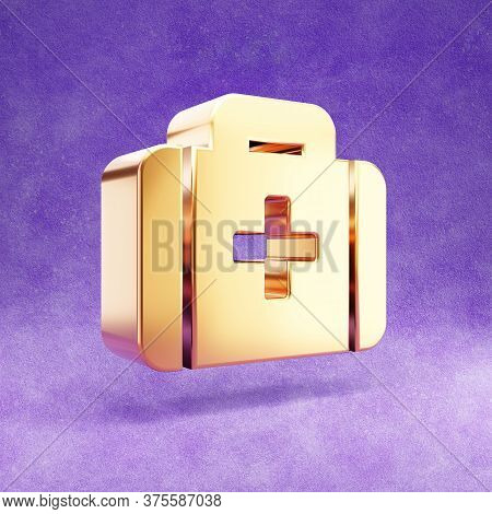 Medkit Icon. Gold Glossy Medkit Symbol Isolated On Violet Velvet Background. Modern Icon For Website