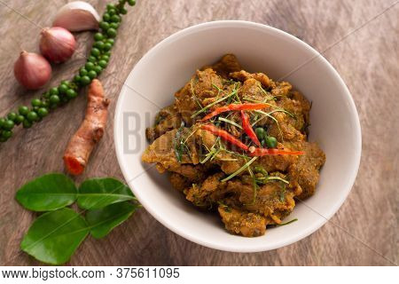 Stir Fried Mince Pork With Yellow Chili Curry Paste. Traditional Local Southern Thai Food. Hot And S