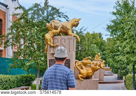 Tyumen, Russia - 24 2020: Tourist Walking Through The Square Of Siberian Cats. Animals Went From Sib
