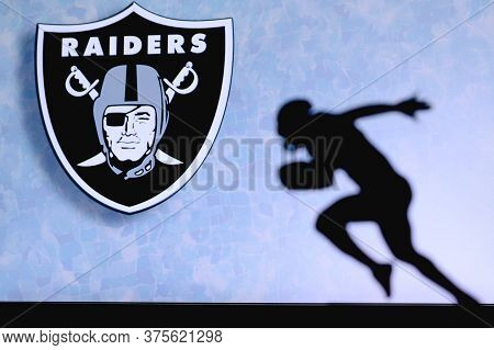 Las Vegas Raiders. Silhouette Of Professional American Football Player. Logo Of Nfl Club In Backgrou