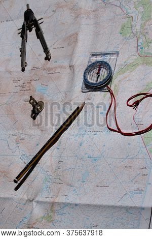 Map With Measuring Tools, Pencil, Compass, Dividers, Magnifying Glass Depicting Planning Concept