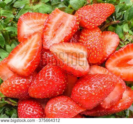 Liced Strawberries As Texture And Background.
Fresh Slice Strawberry, Macro, Red Background.