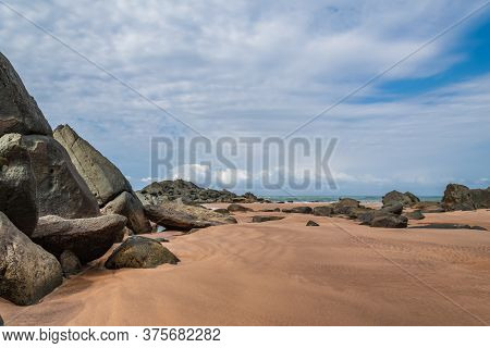 Africa Sea Coast With Large Black Rocks Beautifully Situated On The Beach In Axim Ghana West Africa
