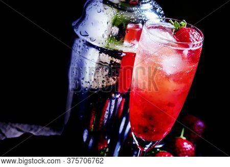Alcoholic Cocktail Strawberry Malarkey With Fresh Berries, Liquor And Champagne Brut, Dark Backgroun