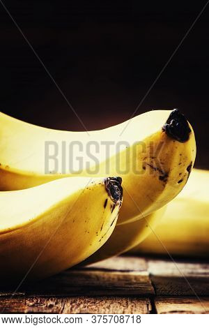 Ripe Bananas On A Vintage Wooden Background, Rustic Style, Selective Focus