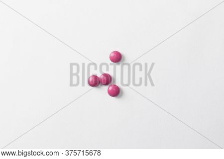 Red Pills On White Background. Pharmacies And Pharmacology Concept