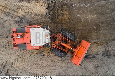 The Grader Repairs The Road Top View
