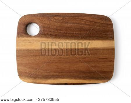 New Cutting Or Serving Board Of Acacia Wood Isolated On White Background. New Rectangular Chopping B