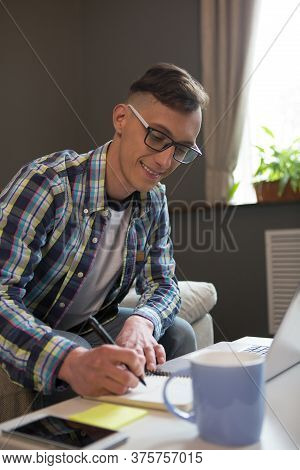 Happy Freelancer Man Works Drawing Diagram. Freelance Concept. Modern People Chose To Work Remotely.