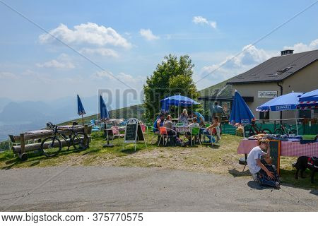 People Eating On A Restaurant On Capriasca Valley Over Lugano On Switzerland