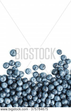 Tasty Blueberries Fruit Are Scattered On A White Background. Frame