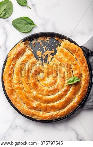 Filo Spinach And Feta Twist Pie In The Iron Pan After Oven. Authentic Greek Bakery. With Spinach, Mi