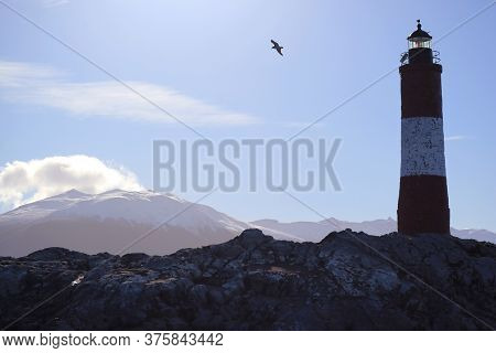 Les Eclaireurs Lighthouse On A Rocky Islands In Beagle Channel, The Iconic Landmark Of Ushuaia, Tier