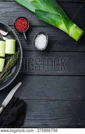 Raw Leeks Sultan  Chopped Oninon On Grill Pan Uncooked With Herbs Ingredients , On  Black Wooden Tab