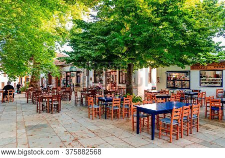 Lafkos / Greece - July 4 2020: View Of The Historic Square Of The Village, With Cafeterias And Resta