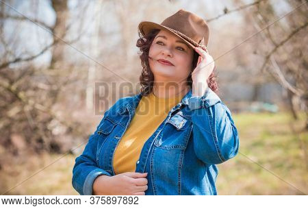 Mature Plus Size Woman, American Or European Appearance Walks And The  Enjoying Life. Lady With Exce