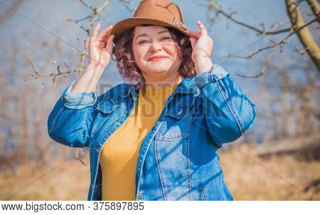 Mature Plus Size Woman, American Or European Appearance Walks And The  Enjoying Life. Lady With Exce