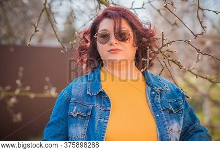 Mature Plus Size Woman, American Or European Appearance Walks And The  Enjoying Life. Lady With Exce