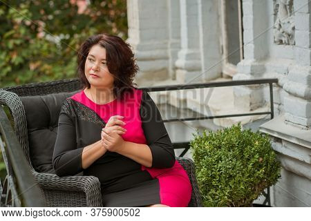 Mature Plus Size Woman, American Or European Appearance Walks And The  Enjoying Life. Lady With Exce