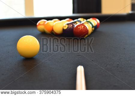 Black Billiard Table, Playing Snooker Pool 8Ball - Close-up Shot Of A Man Playing Billiard