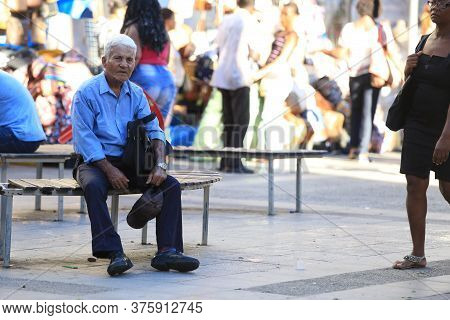 Salvador, Bahia / Brazil - March 19, 2018: Elderly Man Is Seen In The Square In The City Of Salvador