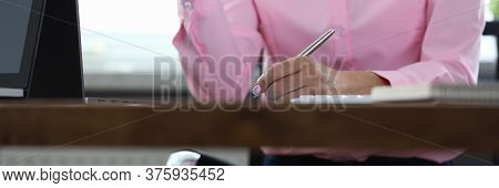 Woman Sitting Office Takes Notes During Discussion. Well-equipped Workplace. Attendant Support Staff