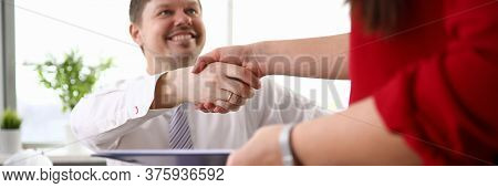 Close-up View Of Co-workers Shaking Hands And Smiling To Each Other. Man In Disabled Carriage. Worki