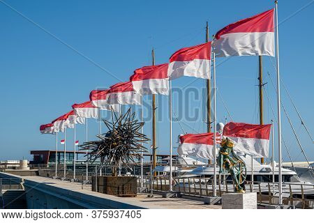 Monte Carlo, Monaco - July 7, 2020: The National Flag Of Monaco Consists Of Two Horizontal Stripes I